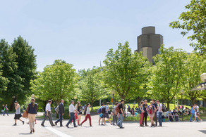People are walking across the North Campus.